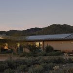 house with rooftop solar panels