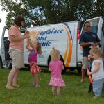 kids in front of southface solar electric van