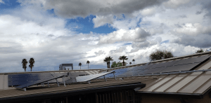 Off-grid solar panels on metal and flat roof in the city with SRP
