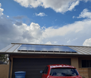 Black Solar panels mounted on a metal roof