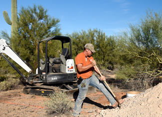 Corey Garrison installing a ground mount solar array