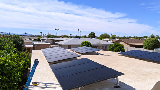solar panels on roof with view of houses