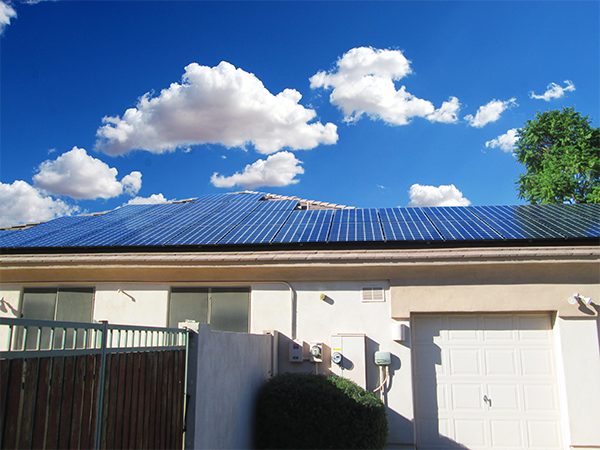 house with solar panels and sky