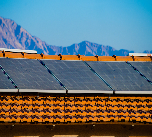 blue photovoltaic panels on house in arizona