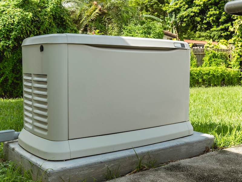 A Home Standby Generator installed at the backyard of a house