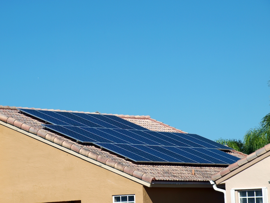 solar panels installed on the a roof of tiles of a residential home