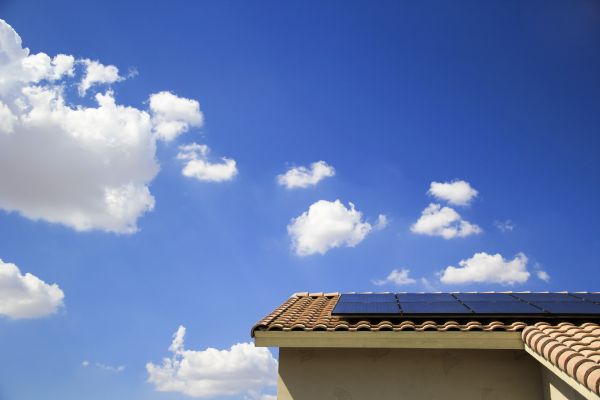 New solar array atop southwestern home with blue skies in background