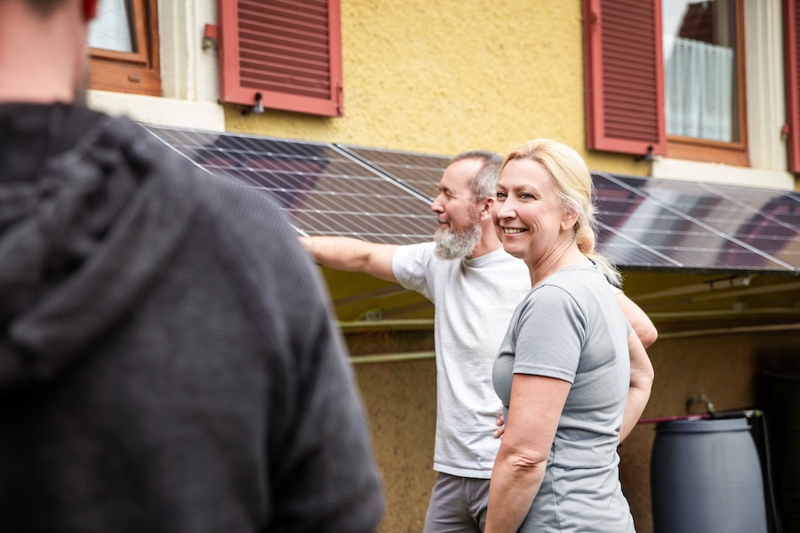 family talking about aps changes with solar contractor