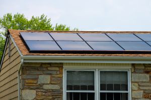 all black solar panels on a roof of a home