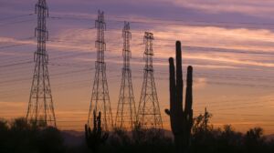 Desert sunset power electricity pylons on beautiful Arizona evening